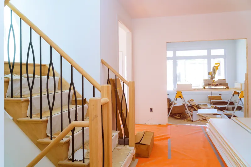 New staircase with wrought-iron balusters
