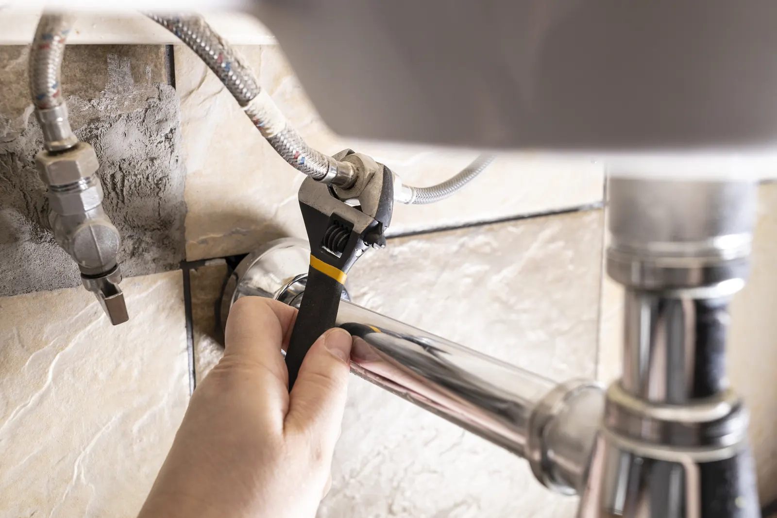 Tightening a supply connection under the sink